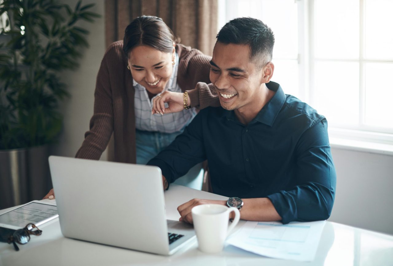 happy-with-how-their-finances-are-looking-shot-of-a-young-couple-using-a-laptop-together-at-home-.jpg